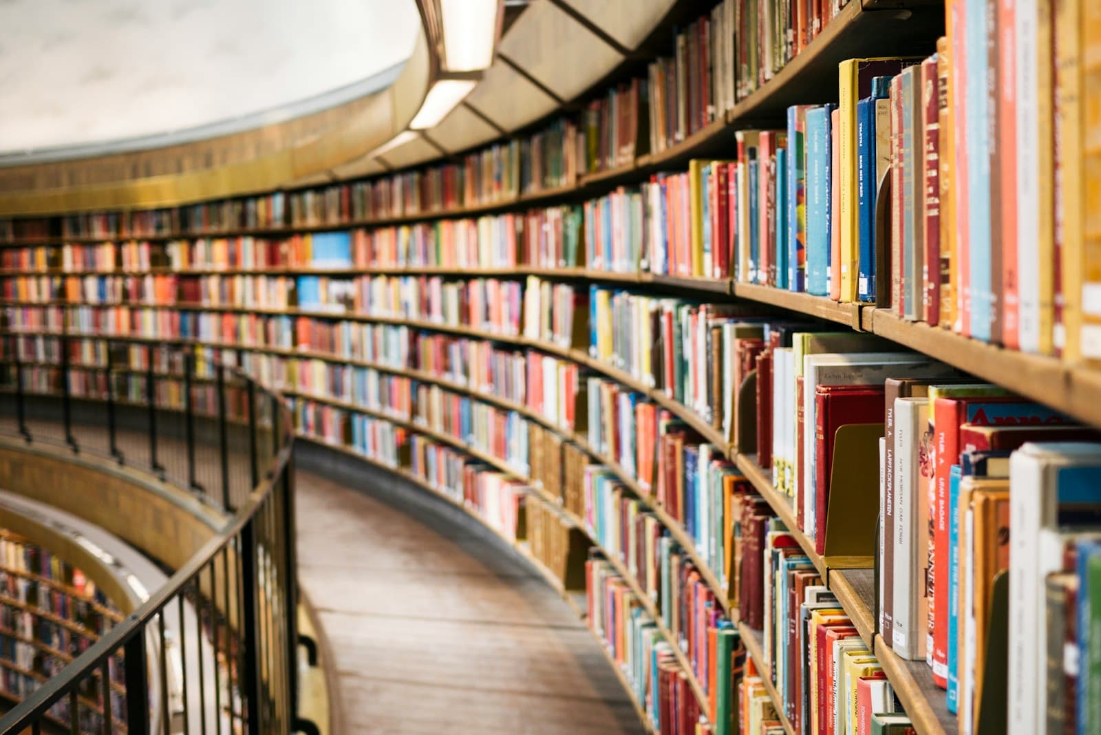 Curved library shelves filled with books