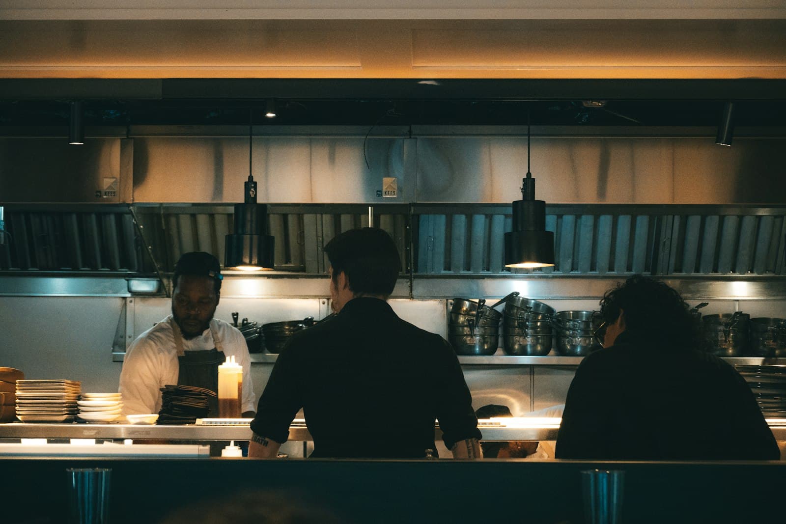 Chefs and staff working in a busy restaurant kitchen