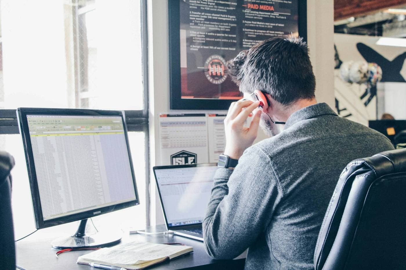 Property manager reviewing synced unit and pricing data on a monitor